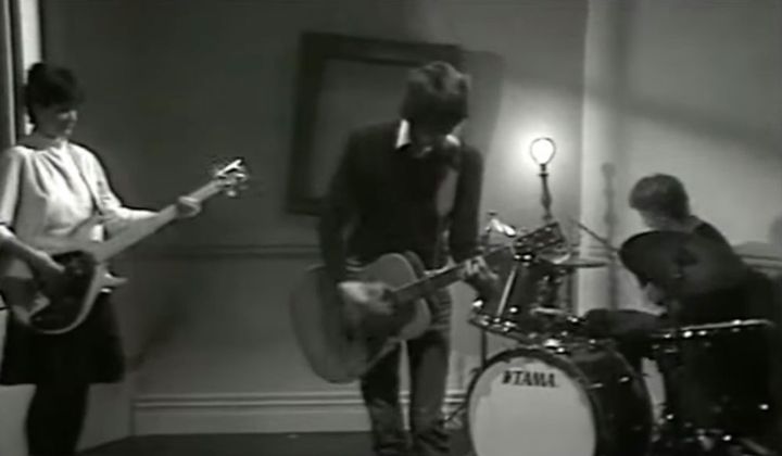 Three piece band performing