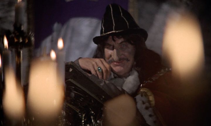 Vincent Price smirking